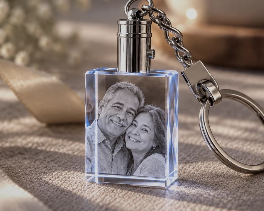 Rectangle crystal keychain with a couple's portrait beside a gift ribbon